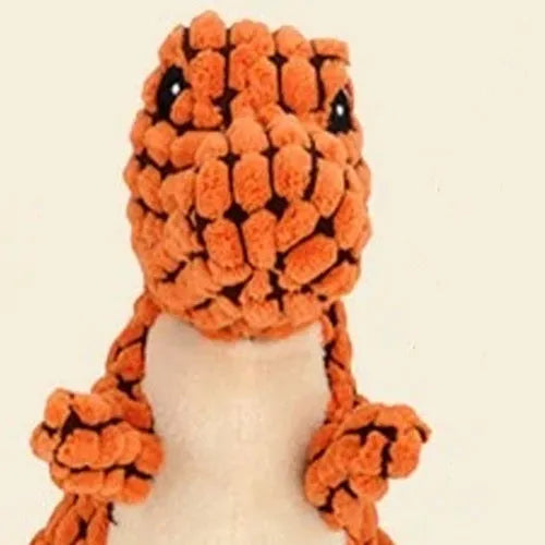 Grey, green, and orange durable rubber dog toy with sound feature for chewing and training.