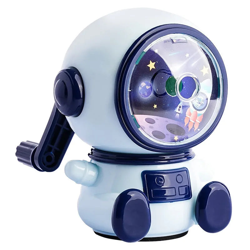 Blue cartoon astronaut manual pencil sharpener with adjustable blades on a white background.