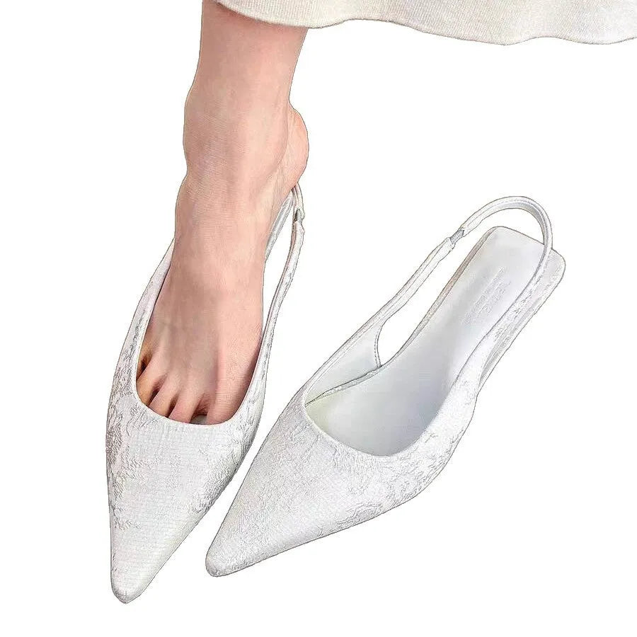White faux suede mid heel stiletto court shoes with Mary Jane strap, pointed toe, and rubber sole, sizes 35-39