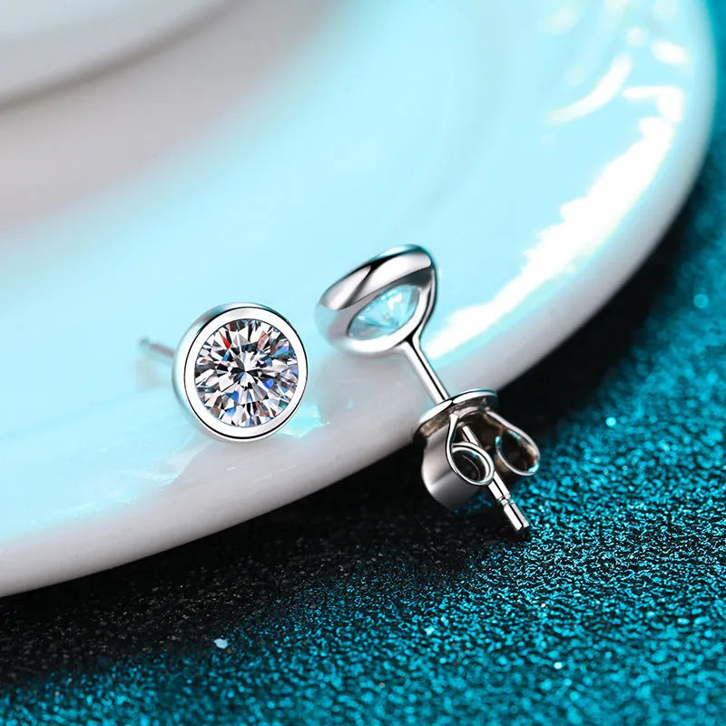A pair of sterling silver earrings with geometric design and a choice of moissanite or zircon stone.