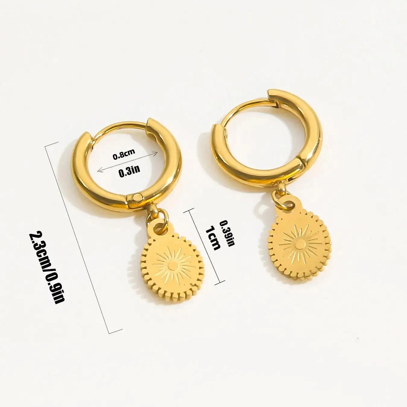 A pair of stainless steel ellipse-shaped button earrings for women on a plain background.