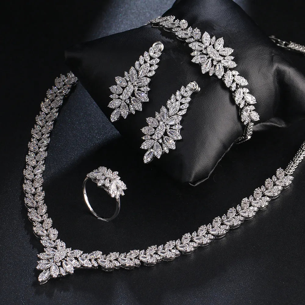 White copper bridal jewellery set with tassel earrings, necklace, bracelet, ring and snake bone chain