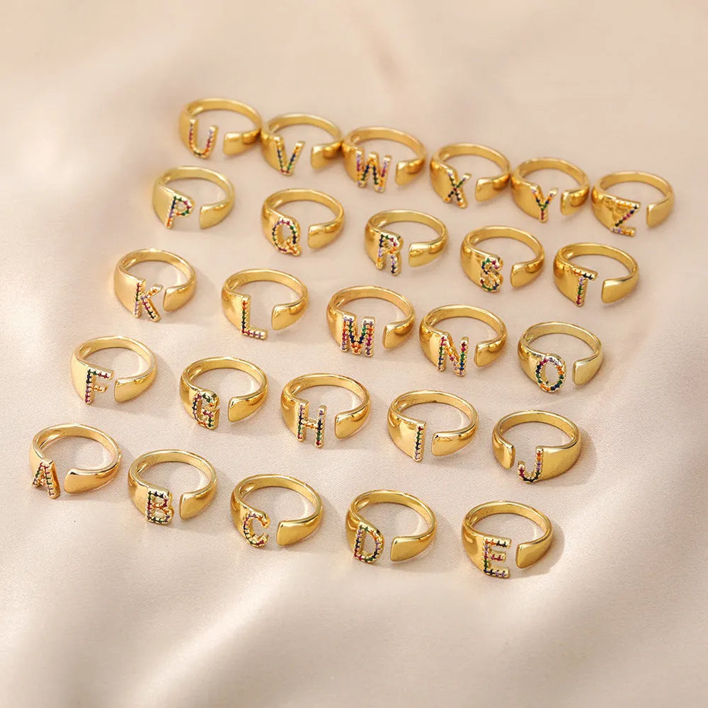 Adjustable copper open ring with coloured zirconium micro-set English letter design