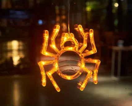 Halloween LED hanging lights with spider, pumpkin and ghost designs featuring suction cups for window mounting