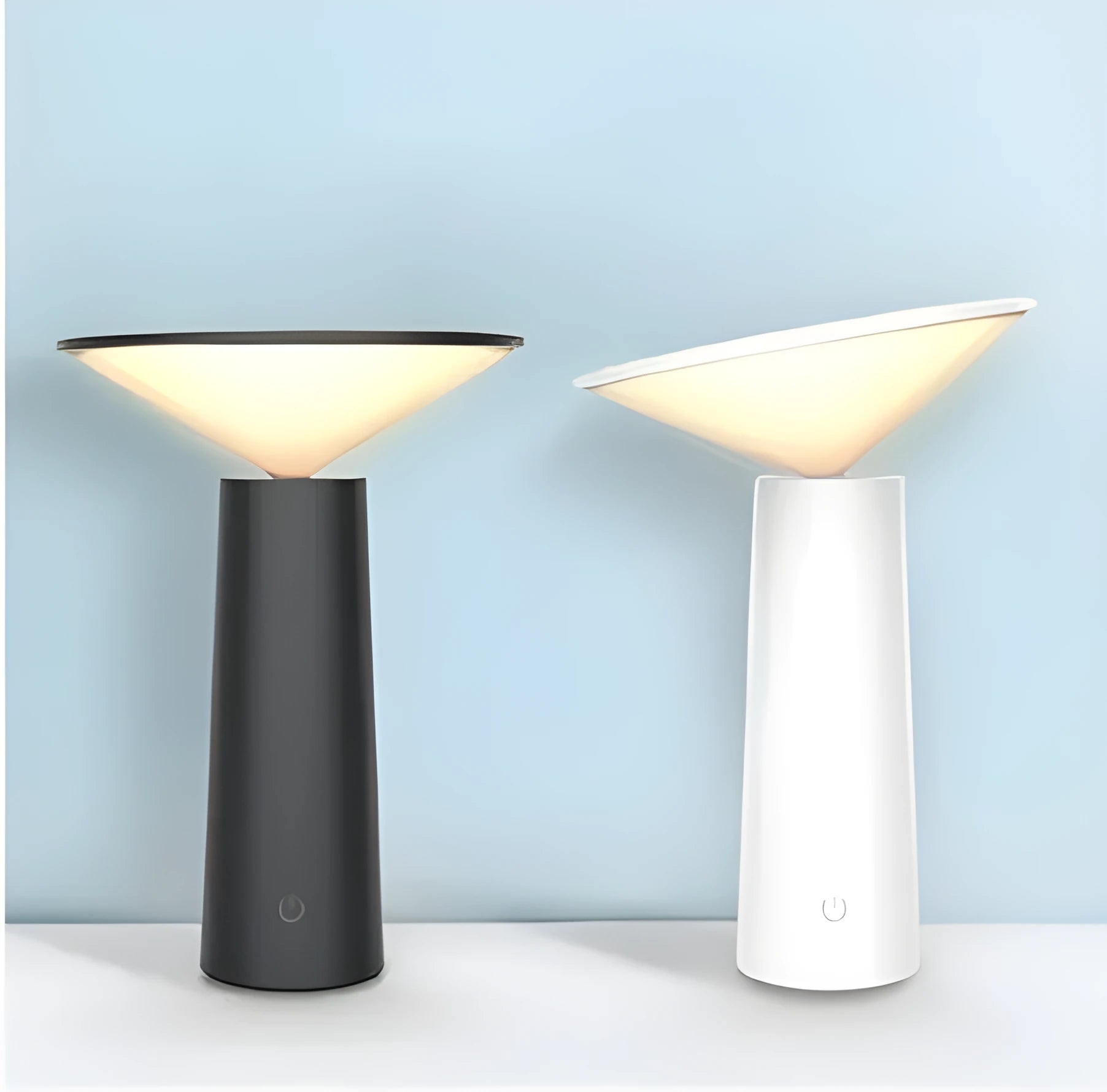 Black USB rechargeable table lamp with adjustable LED reading light head on a desk.