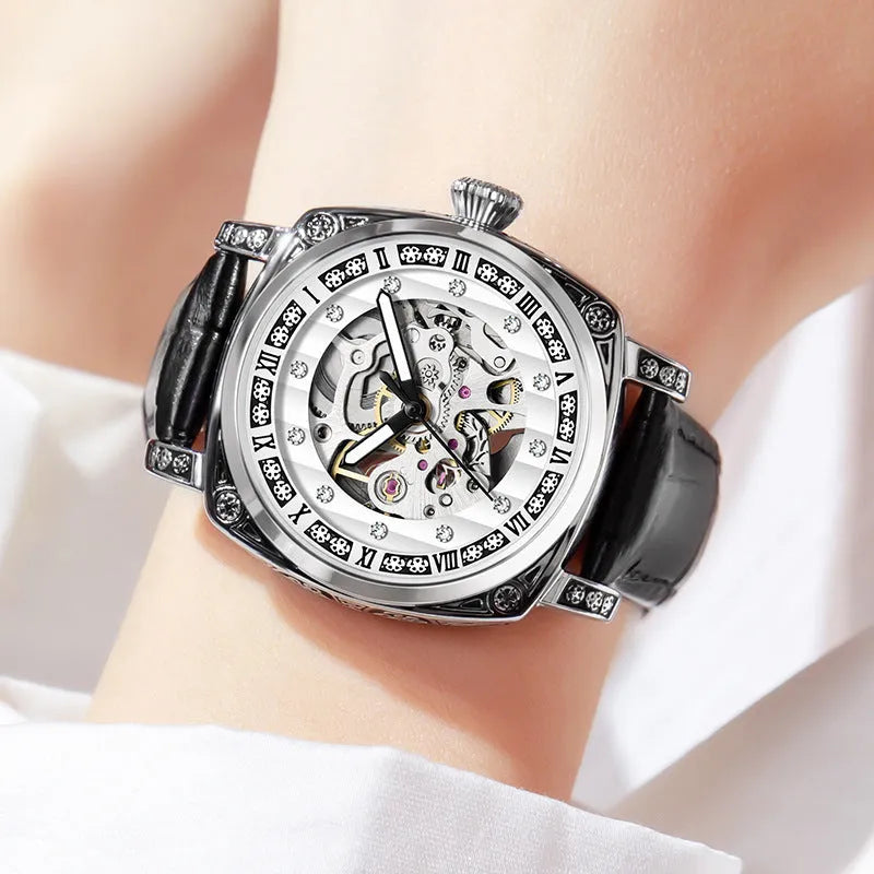 Mechanical watch with luminous hands and a black leather strap, showing 10m water resistance.