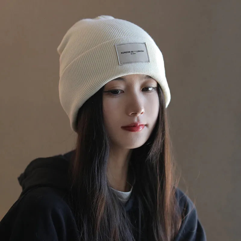 Women's knitted hat in dome crown style, polyester, available in pink, khaki, black, and beige for winter