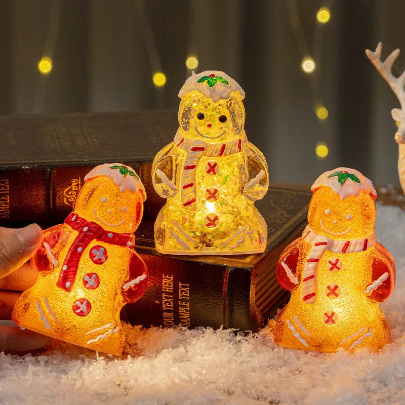 Glowing plastic gingerbread man Christmas ornament with red scarf, showing modern design and compact size.