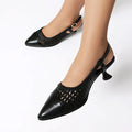 Women's black cat heel sandals with a hollow design and buckle strap closure.