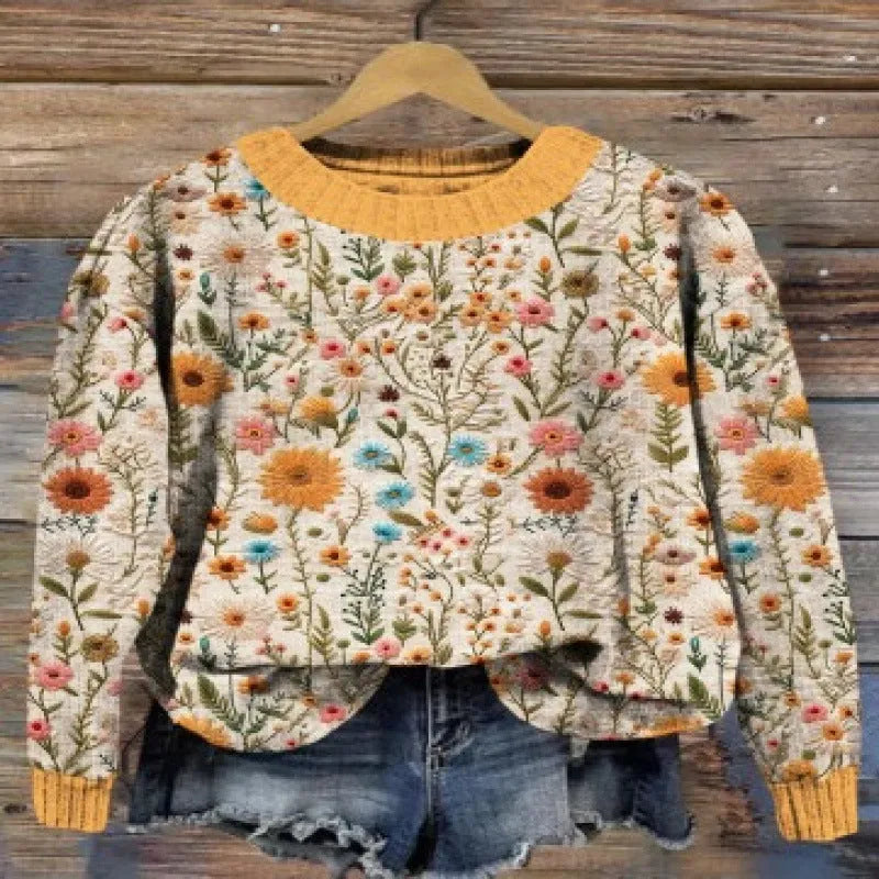 Women's round neck long sleeve sweater with a digital floral print pattern.