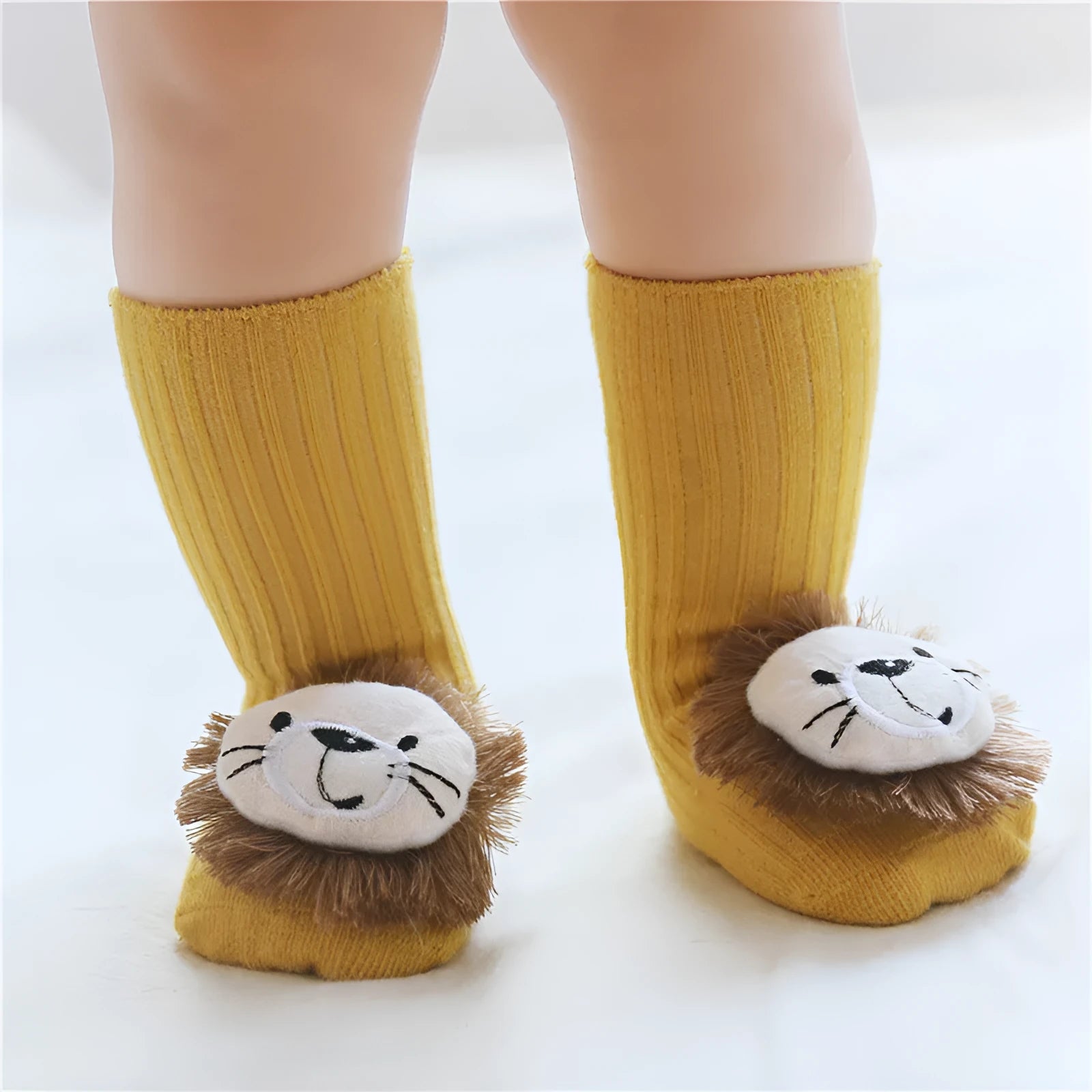 Cotton baby floor socks in various colours and patterns including bows, stars, and animal designs