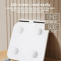White professional body fat scale with 8 electrodes and a large tempered glass platform.