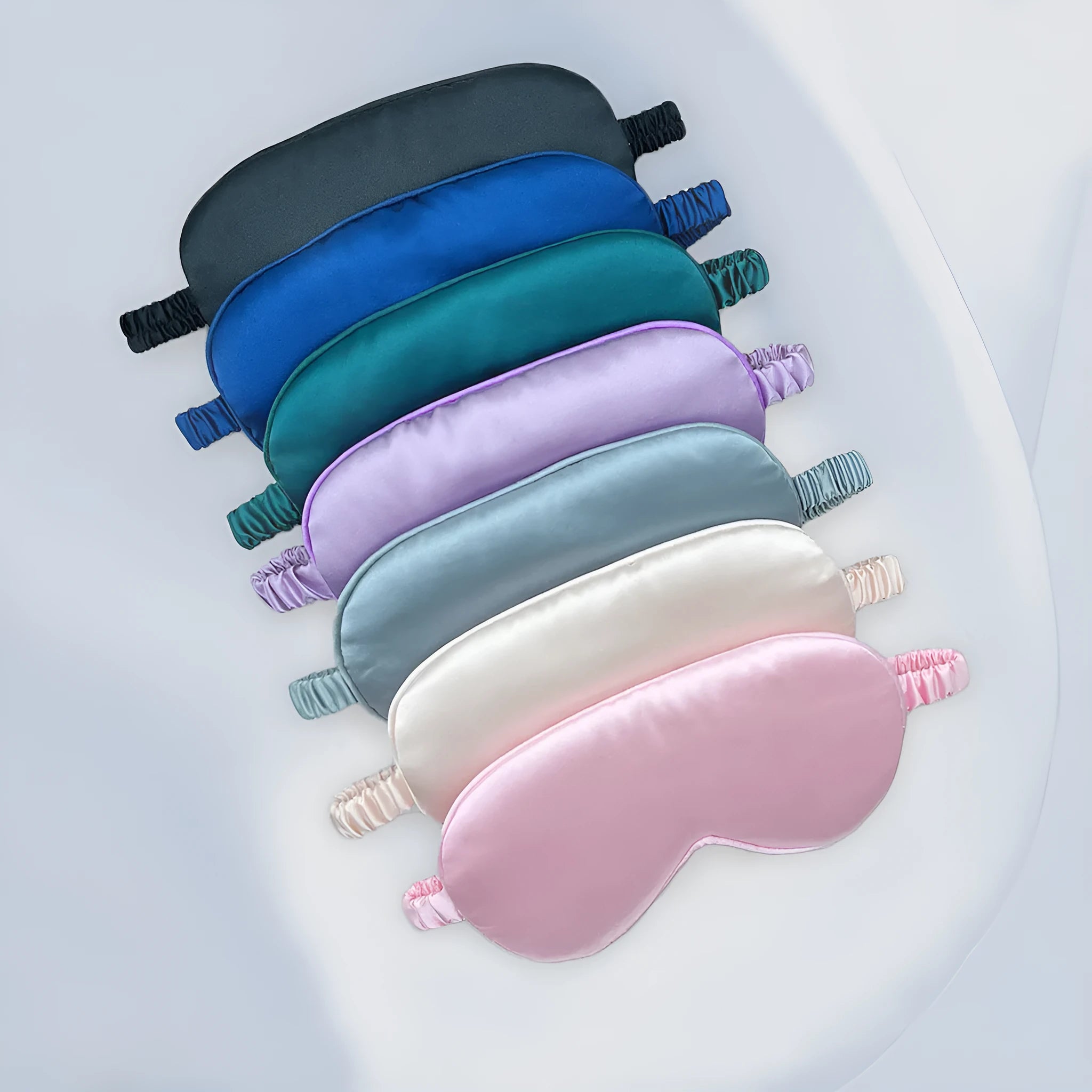 Double-sided rayon elastic satin sleep mask shown in multiple colour options including black, sky blue, and wine red.