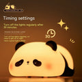 Panda-shaped night light with black and white silicone construction showing LED glow