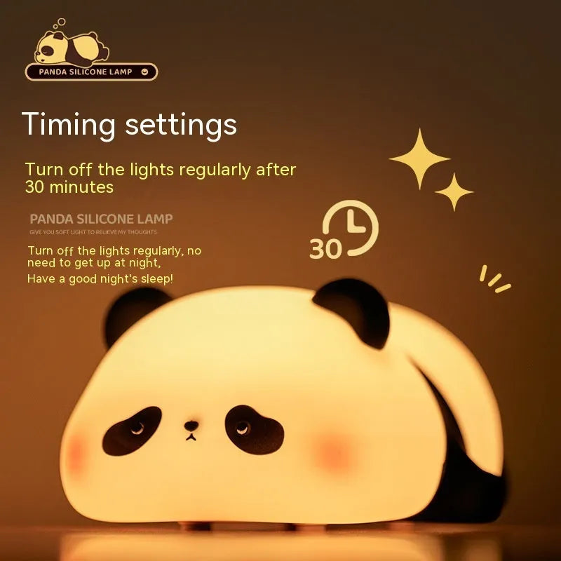 Panda-shaped night light with black and white silicone construction showing LED glow