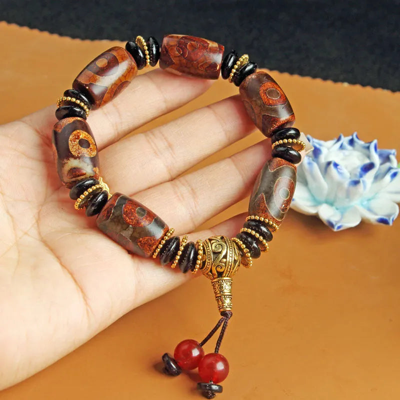 Distressed agate Tibet beads bracelet with three eye dzi design and polished stone beads