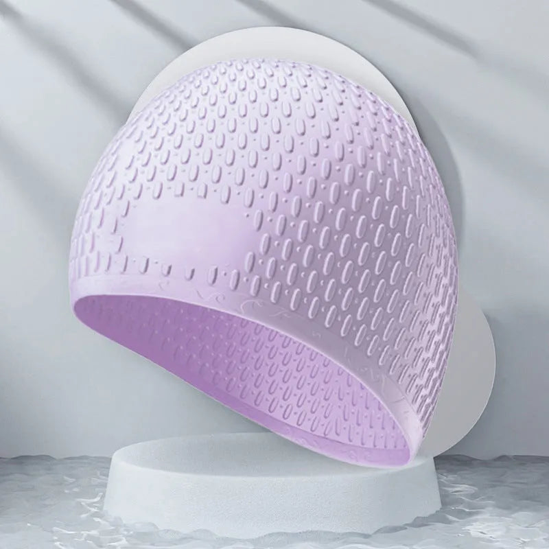 A solid colour silicone swimming cap for adults, shown in one of nine available colour options.