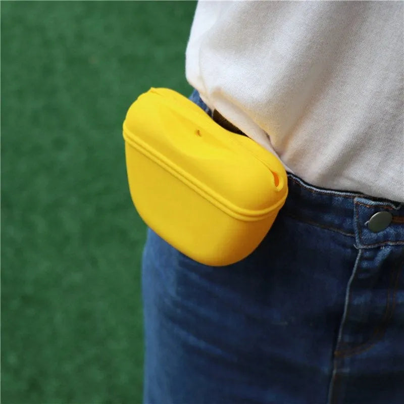 A portable silicone dog treat waist bag with a clip and magnetic opening, shown in available colours.