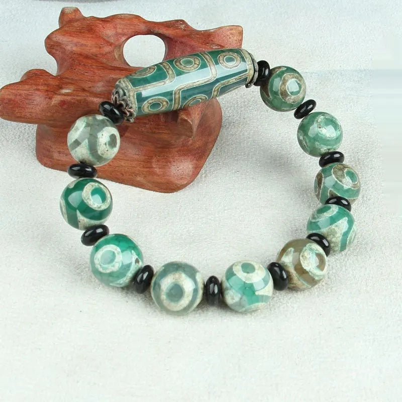 Distressed agate Tibet beads bracelet with three eye dzi design and polished stone beads