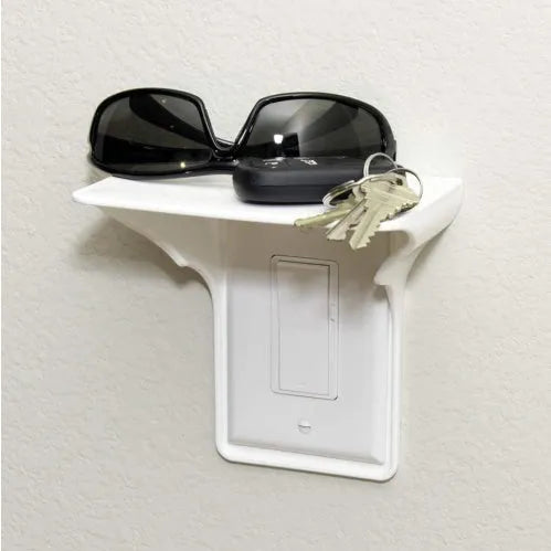 White plastic socket rack organiser for workshop tools on a workbench.