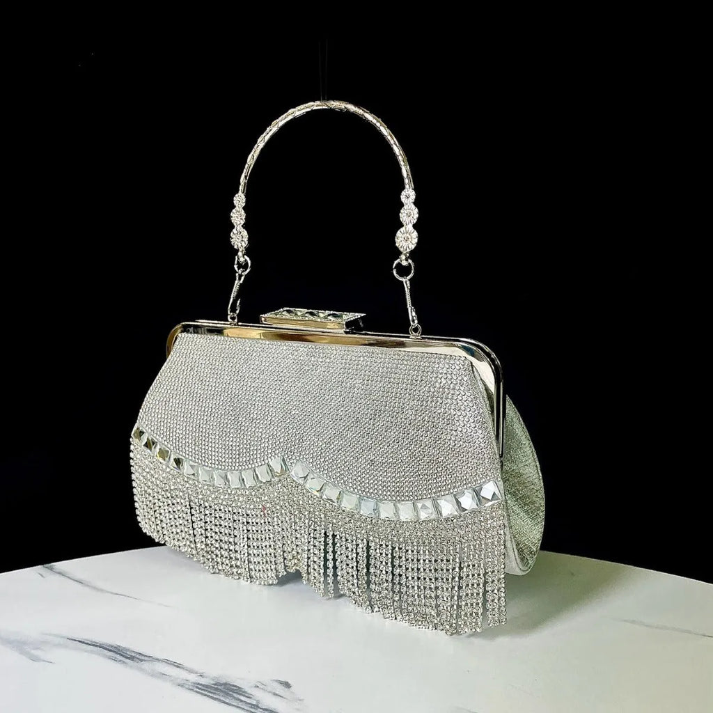 Tassel banquet bag in silver, gold or black polyester with shell shape and chain detail