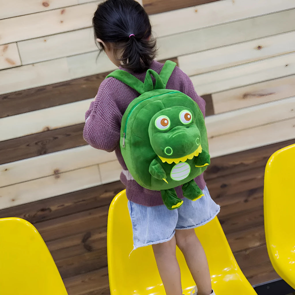 Blue dinosaur plush backpack for children with embroidered design and soft handle