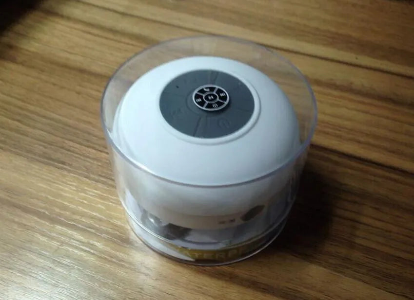 Mini waterproof Bluetooth speaker in blue with USB cable, plastic shell, 98x88x43mm size