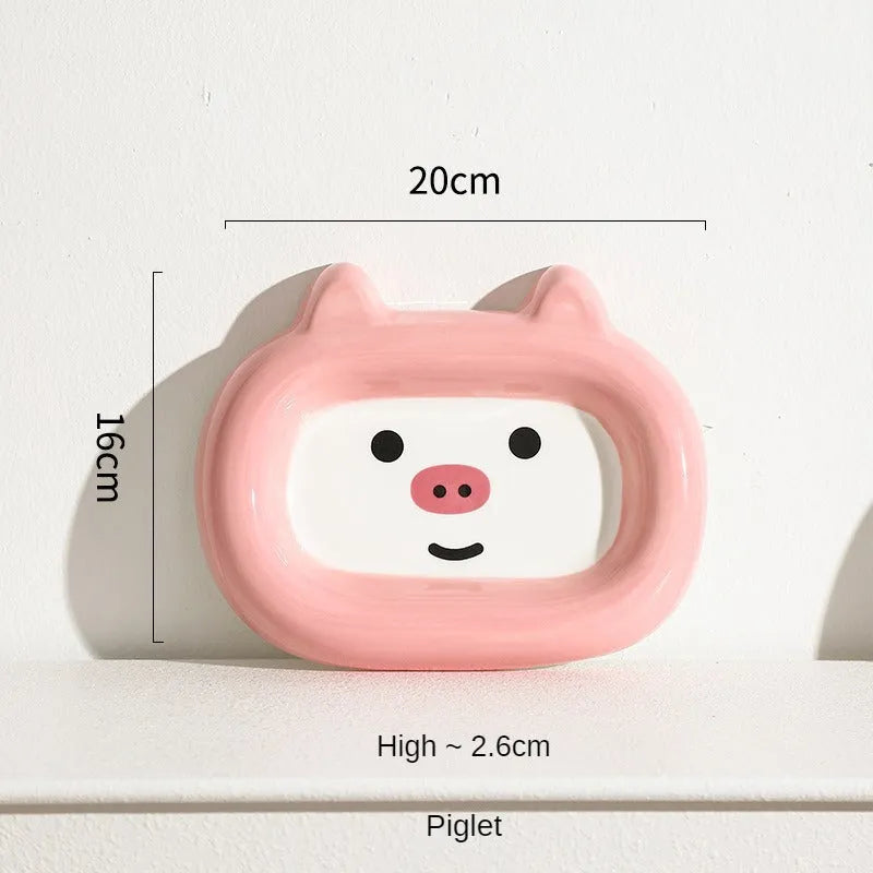 Ceramic pet bowl with a raised animal motif design on the side, shown in one of six available themes.