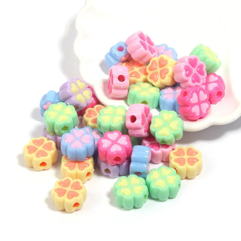15mm acrylic four-leaf clove beads in light colours including rose red, pink, yellow, green, blue, and purple with frosted finish