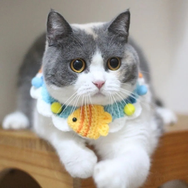 Hand-woven wool cat collar with cartoon Underwater World pattern in blue, size example on a light background