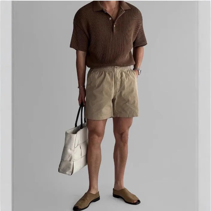Loose-fit cotton sports shorts in black colour shown on model