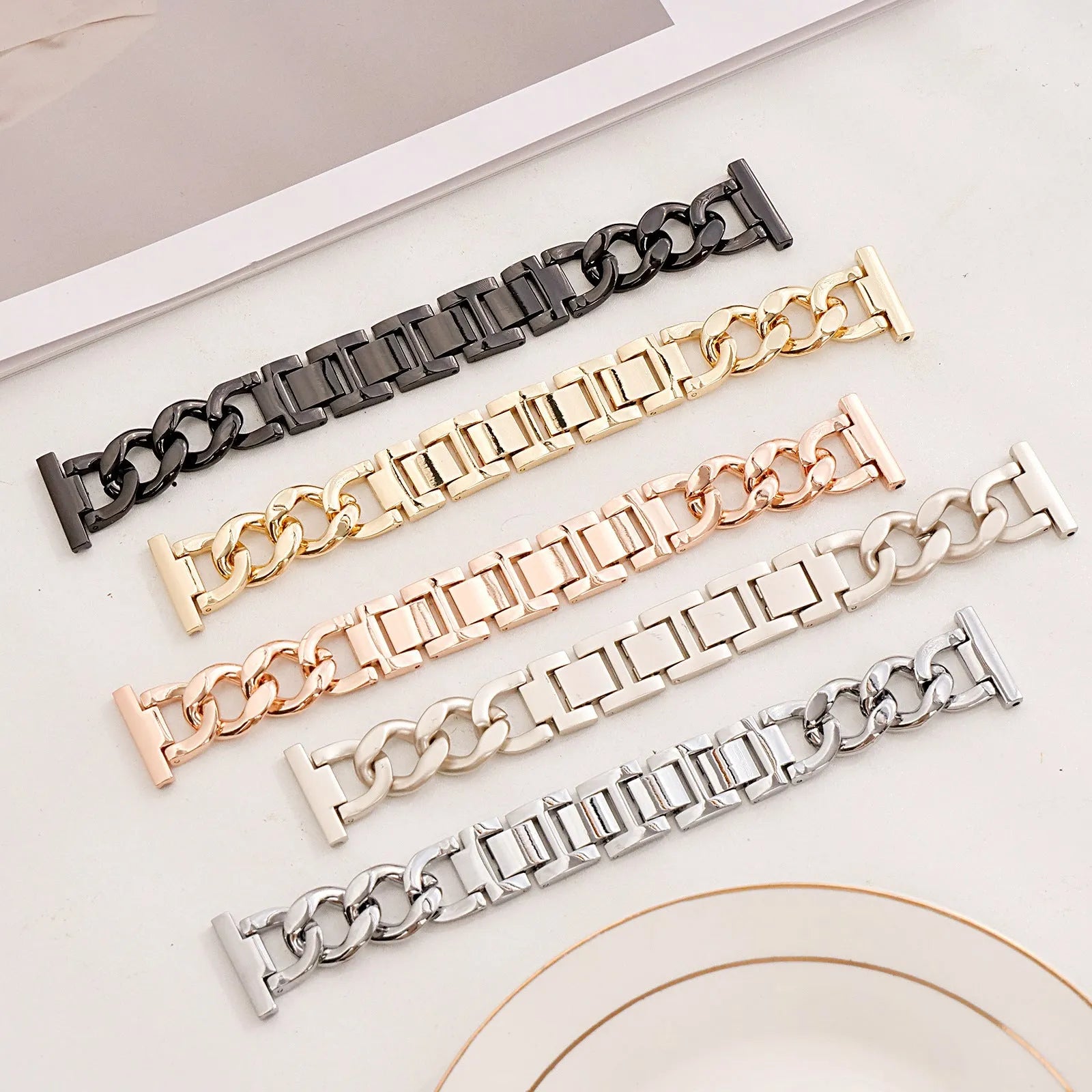 Denim textured metal chain watch strap for Apple Watch in silver, black, gold, rose gold, and starlight colours.
