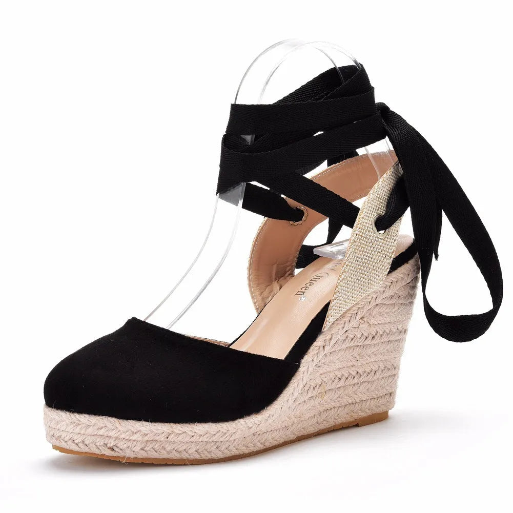 Women's apricot Bohemian wedge sandals with beaded tassels, a buckle, and a platform sole.