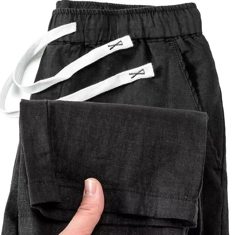Chinese-style straight-leg linen trousers in apricot colour with an elastic drawstring waist.
