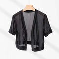 Women's black French-style shirt with irregular collar and long tied bell sleeves.