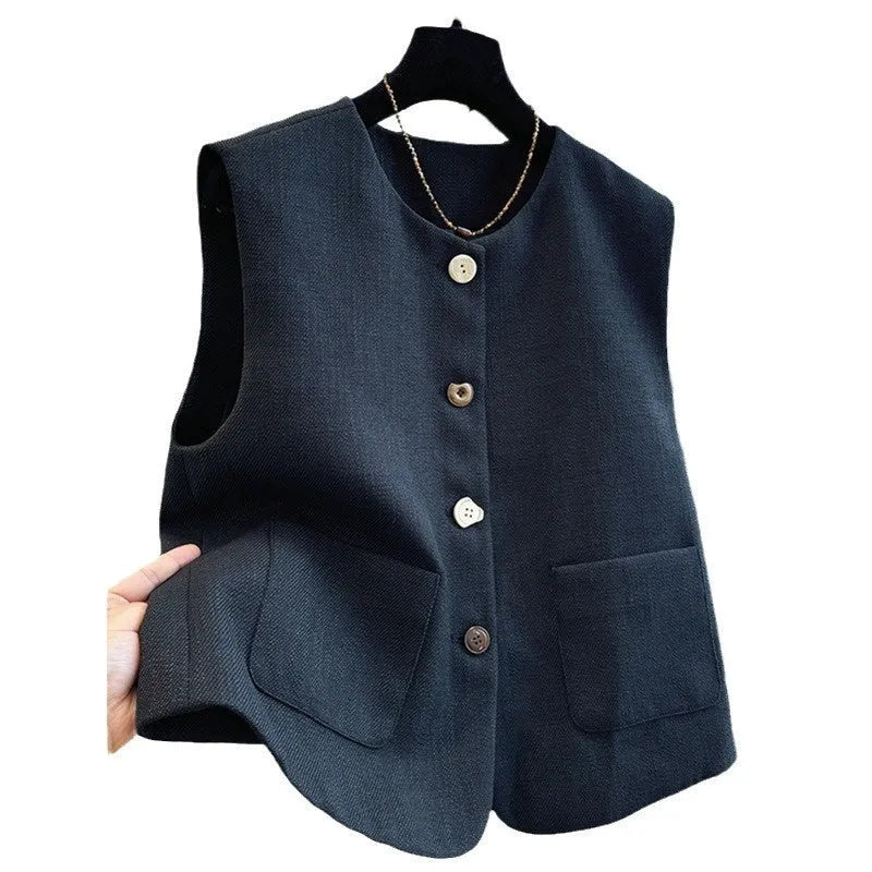 Women's milky white sleeveless bandage vest with round neck, laid flat on a surface.