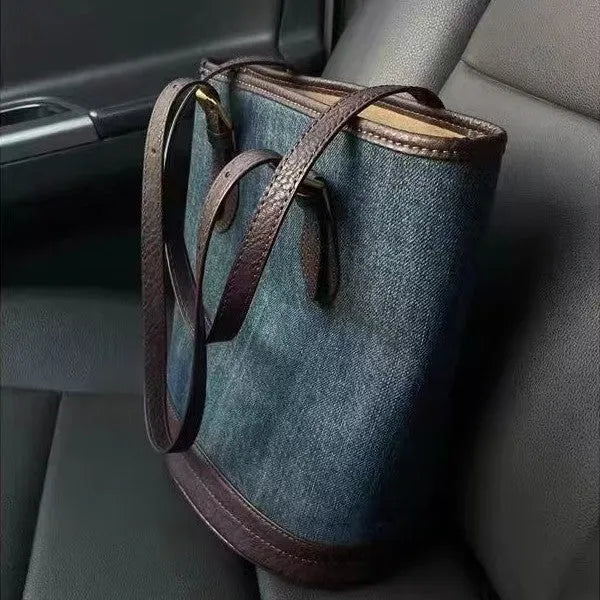 Denim patchwork bucket handbag showing patchwork detailing and one-shoulder strap