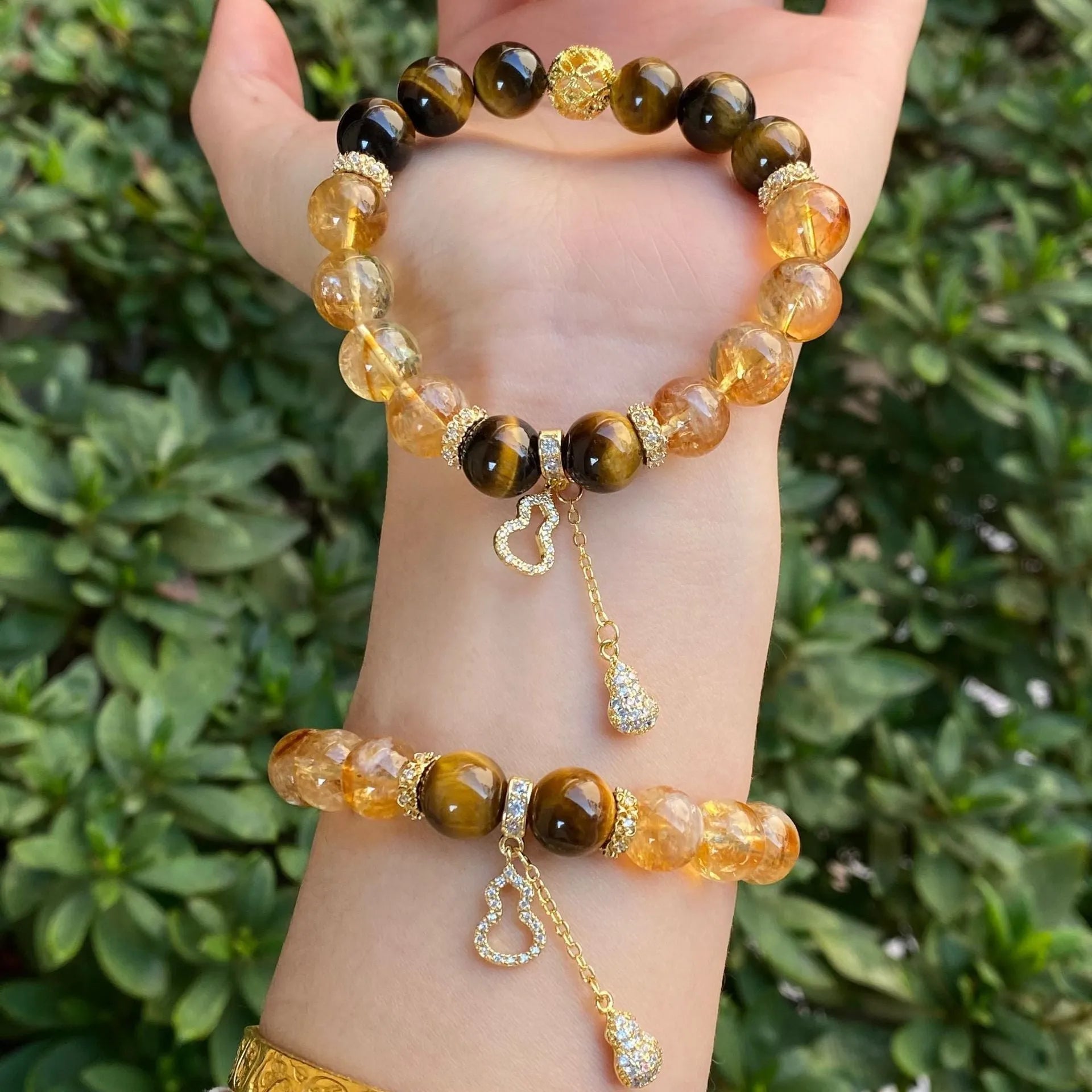 Handmade unisex crystal bracelet with diamond-studded gourd charm and mix of 8mm and 10mm prayer wheel, topaz, and disc beads.