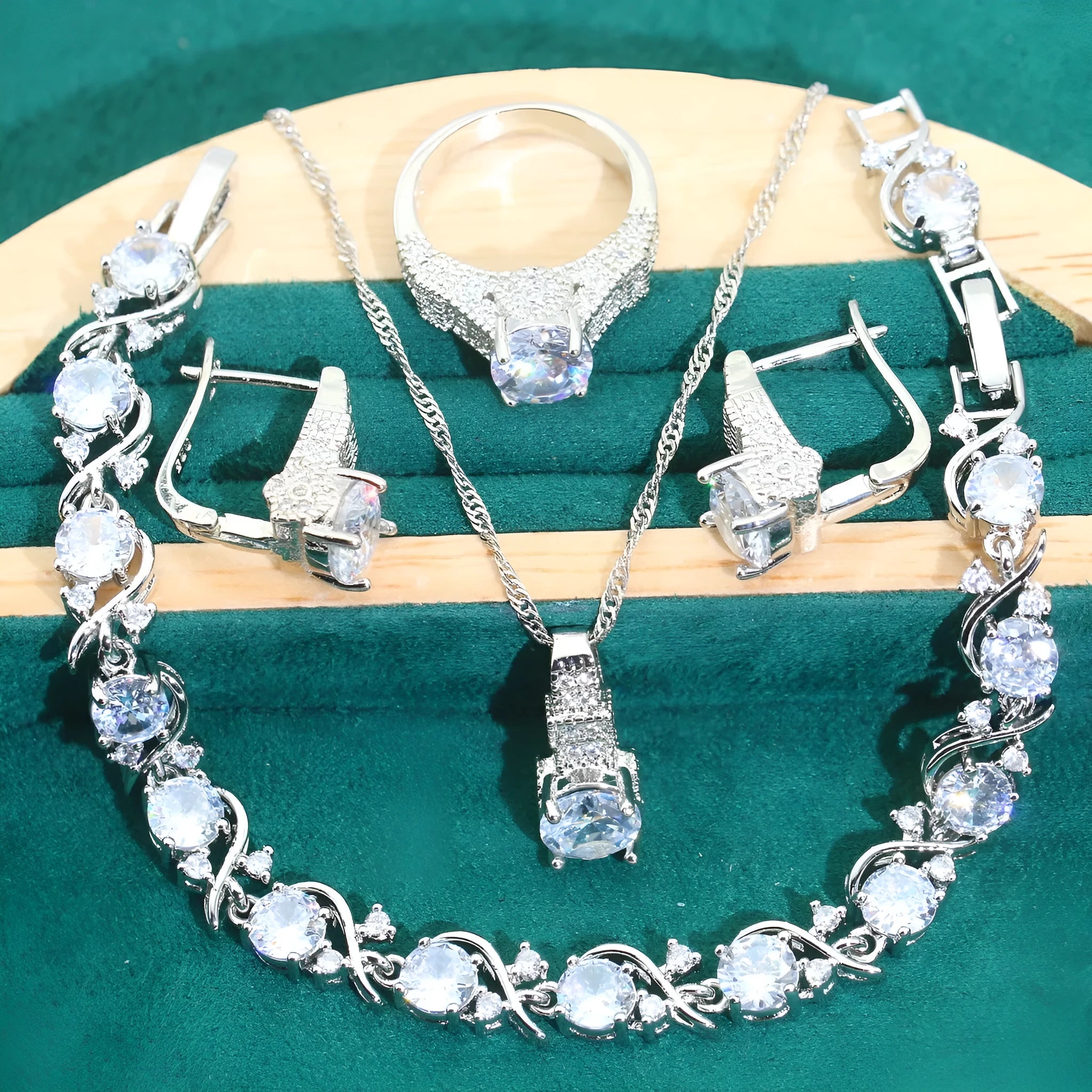 Bridal zircon jewellery four-piece set showing necklace, bracelet, earrings and ring in alloy with water wave chain