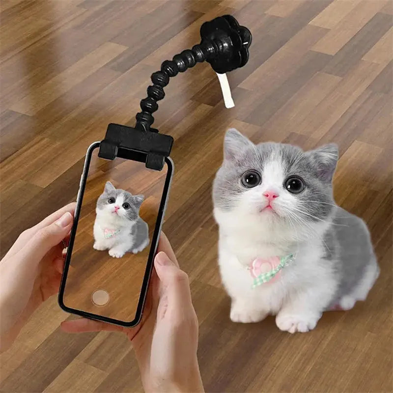 Black pet photography clip holder with rotating attachment for mobile phones and pet treats