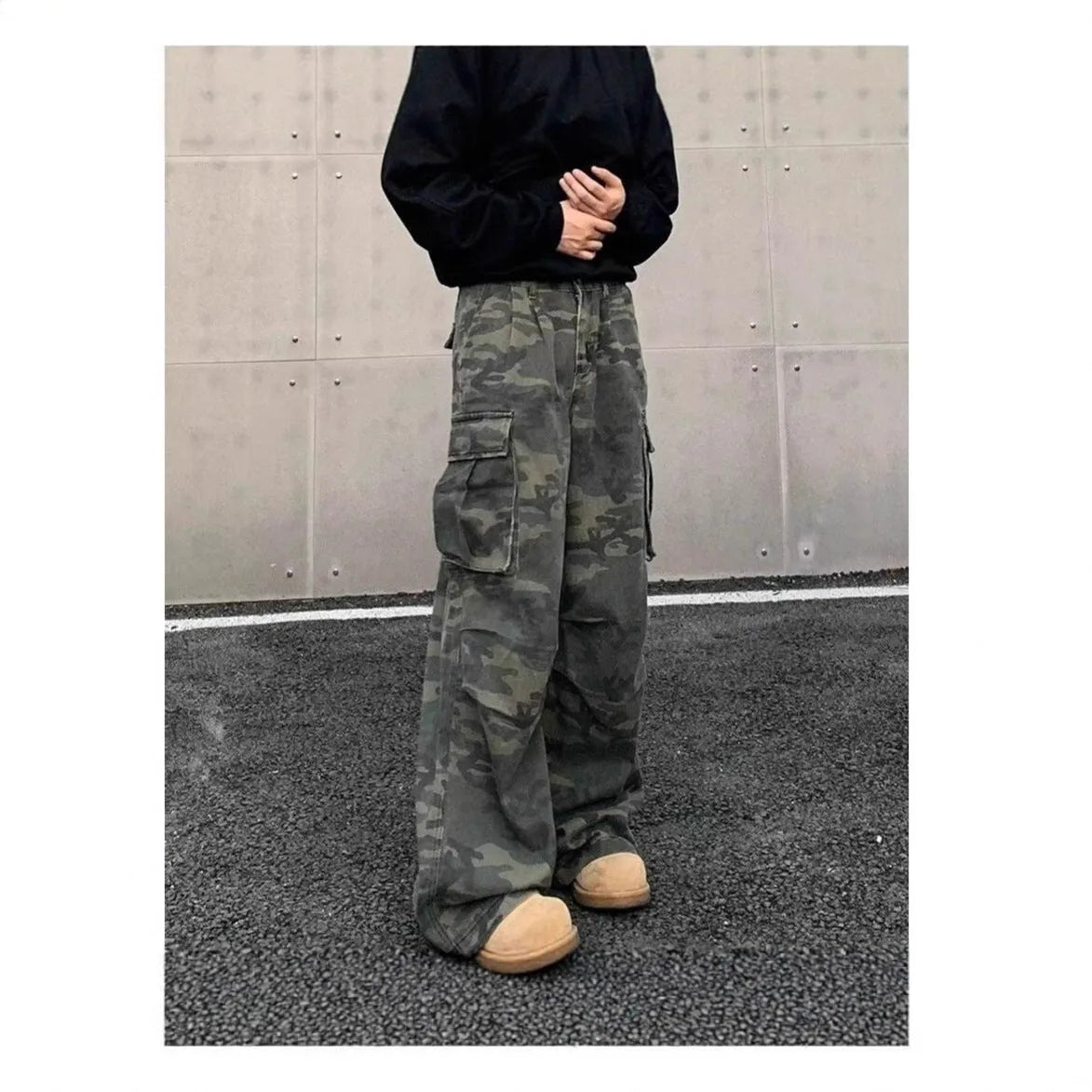 Vintage washed camouflage pattern cargo trousers with multiple pockets on a mid-waist fit.