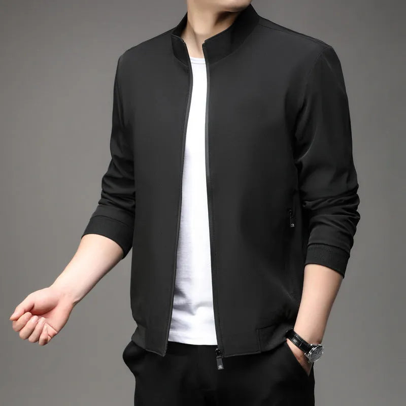 Man wearing a loose-fit Korean style casual jacket in blue, with zip-up front and pocket detail.