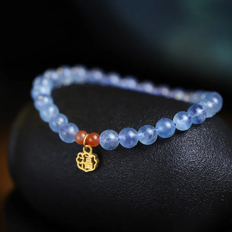 Women's ice translucent bracelet with 8mm crystal beads and a blessing card charm on a white background.