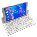 Black folding wireless Bluetooth keyboard for tablets with numeric keypad shown open and closed