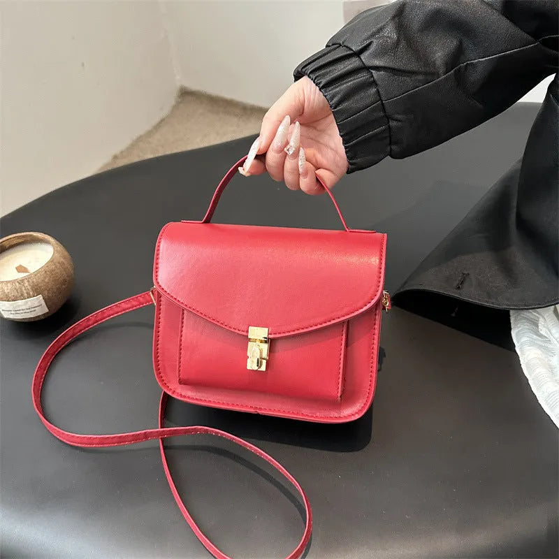 Retro style black shoulder messenger bag with document organiser compartment