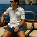 Men's light blue beach shirt and shorts set made from elastic fabric on a hanger.