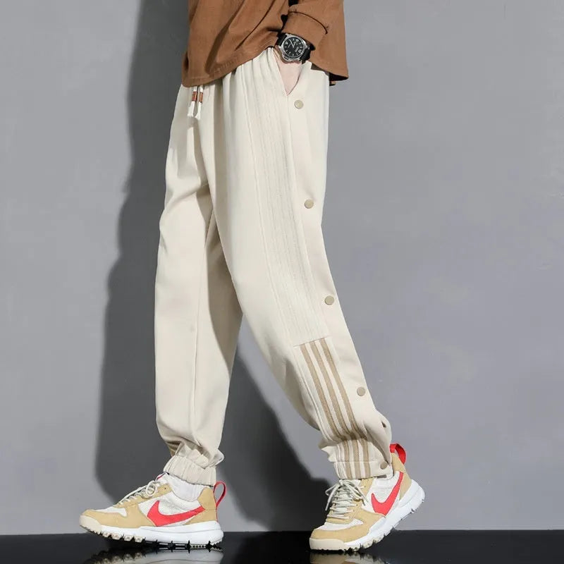 Men's loose fit sweatpants with ankle-tied cuffs in cotton blend fabric