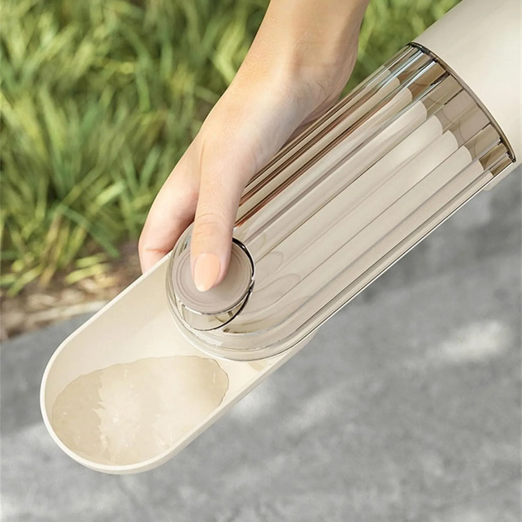 Beige and green foldable dog water bottle with food container, showing dimensions.