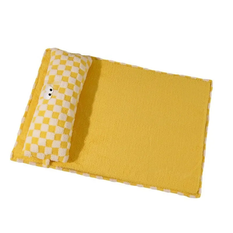 Grey rectangular plush pet cushion for dogs or cats on a wooden floor.
