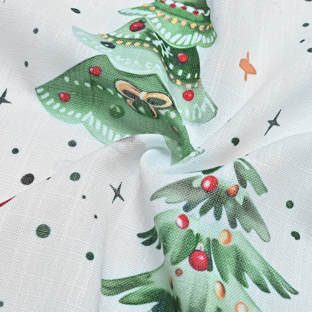Close-up of a needle-punched Christmas Forest pattern on a blackout polyester curtain panel.